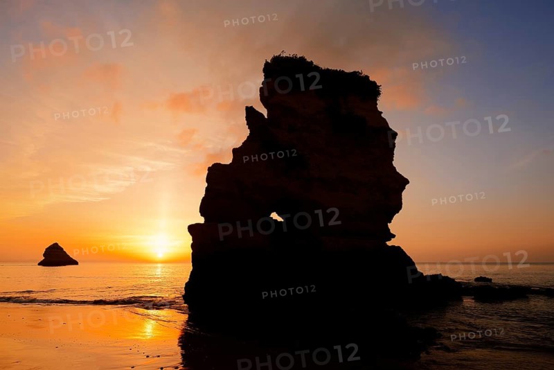 Rock formation on the coast at sunrise, Praia Dona Ana, Lagos, Algarve, Portugal