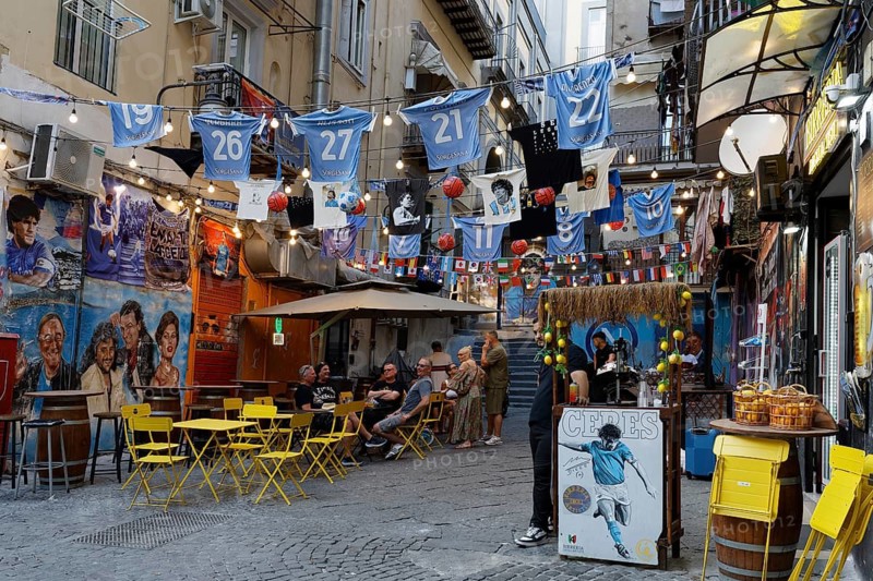 Street scene at Spaccanapoli, pizzeria with soccer decoration, historic old town, Naples, Campania, Italy