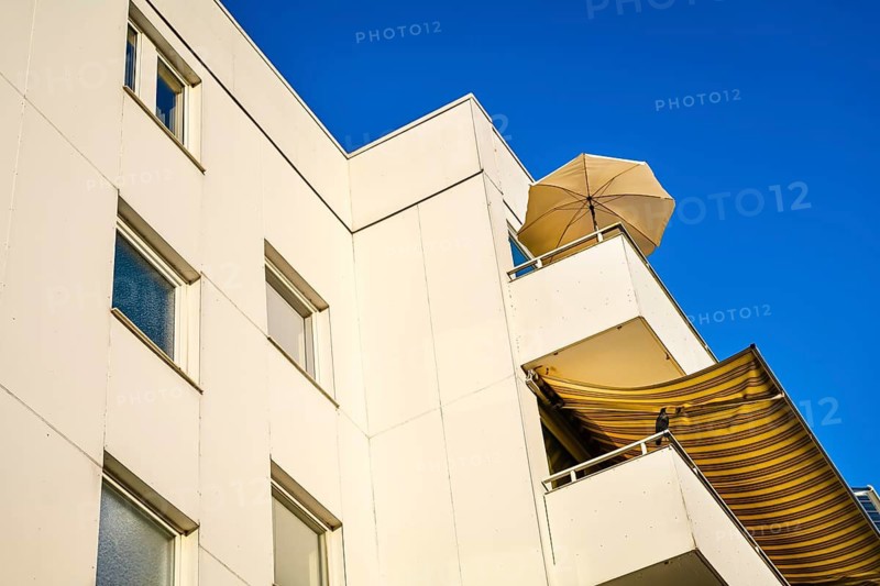 Balconies with parasol and awning in Scharbeutz, Schleswig-Holstein, Germany +++ editorial use only