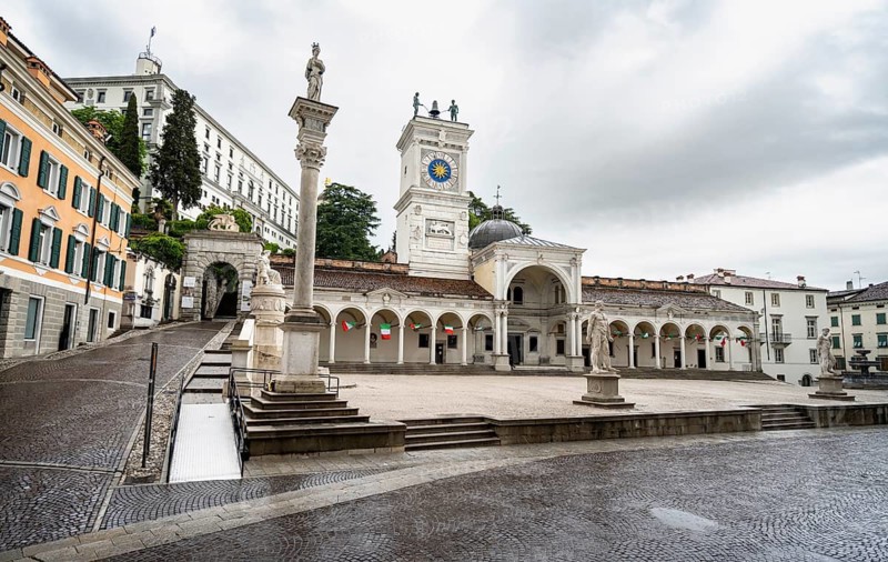 Piazza della Libertà main square with Loggia e Tempietto di San Giovanni and clock tower, Castello di Udine in the back, old town, Udine, Friuli-Venezia Giulia, Italy