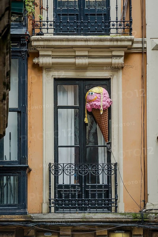 Large replica of ice cream in a waffle above an ice cream parlour, Bilbao, Spain