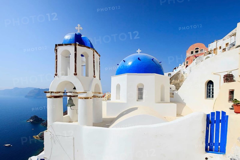 Classic Greek style church in the traditional white and blue village of Oia on Santorini, Greek Orthodox, Santorini, Greece