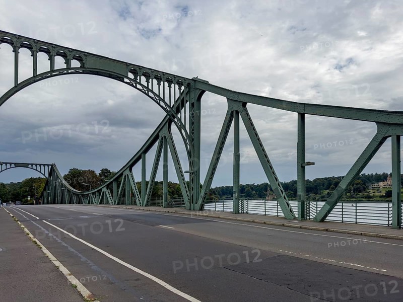 Glienicke bridge. The Glienicke Bridge today forms the city border between Berlin and Potsdam and was the border between Berlin and the GDR and a transfer point for agents from East and West at the time of the division of Germany. Potsdam, Brandenburg, Germany