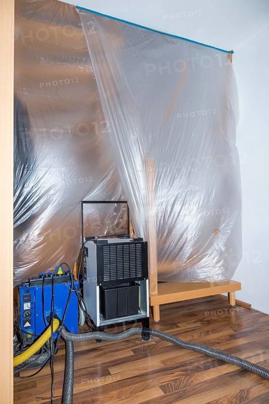 Thermal partition and dust protection wall with film in the hallway when drying screed and buildings with drying devices