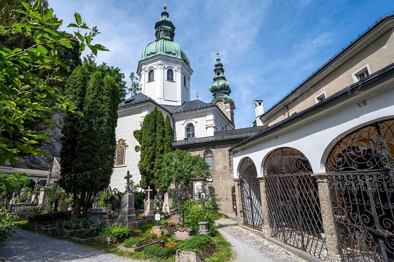 Graves at St. Peter Cemetery with St. Peter Collegiate Church, Old Town, Salzburg, Austria