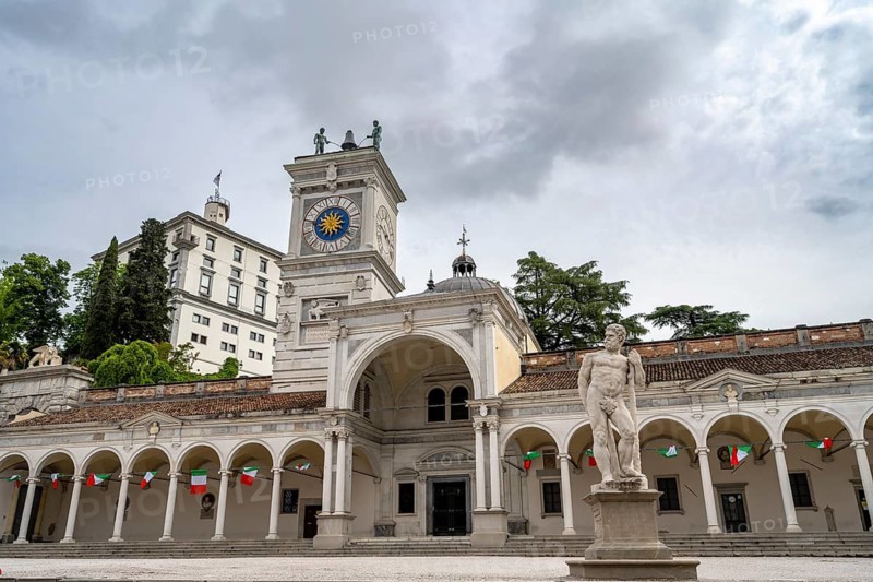 Piazza della Libertà main square with Loggia e Tempietto di San Giovanni and clock tower, Castello di Udine in the back, old town, Udine, Friuli-Venezia Giulia, Italy