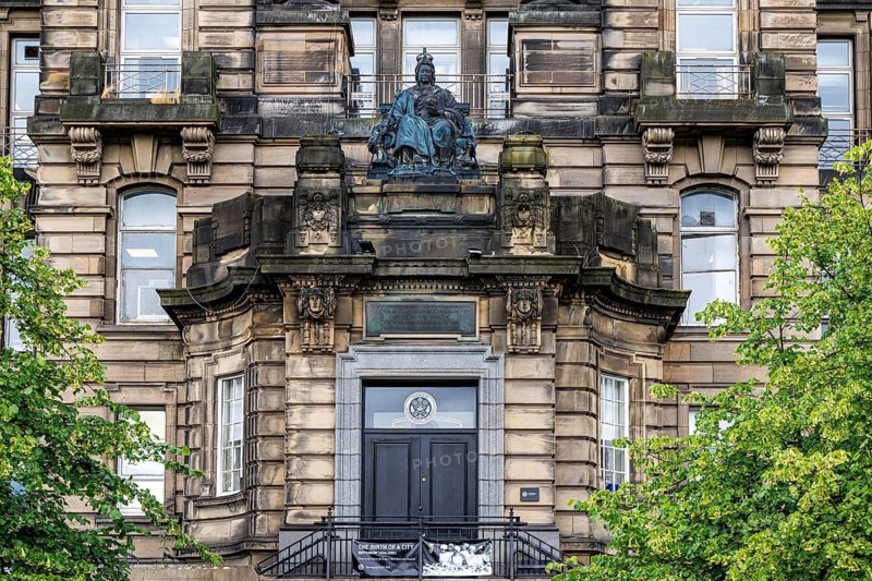 Ornate Edwardian facade of Glasgow Royal Infirmary Jubilee Block is topped by a bronze Queen Victoria statue, Glasgow, Scotland, United Kingdom