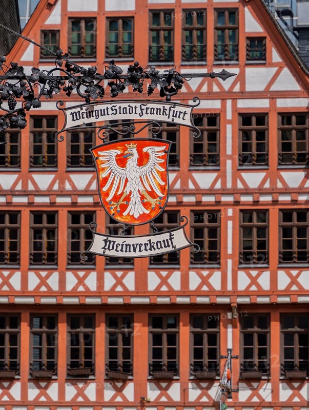 Guild signs and half-timbered houses on the Römerberg in Frankfurt am Main, Hesse, Germany