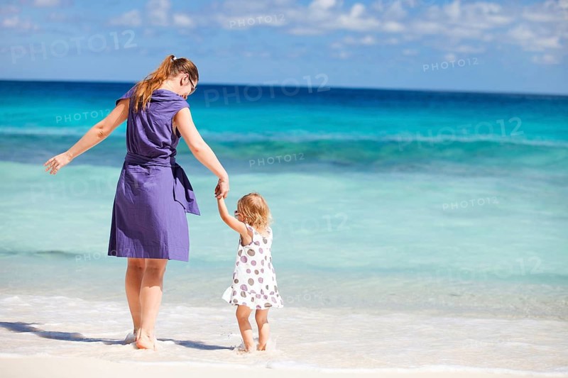 Mother and daughter on beach, Seychelles, La Digue, La Digue, Indian Ocean, Seychelles