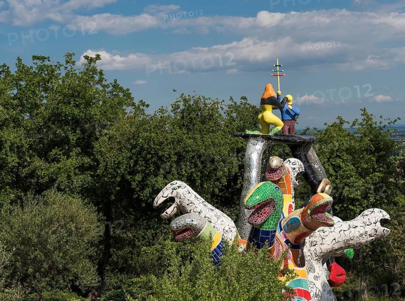Colourful fantasy figure in the Giardino dei Tarocchi or Garden of Tarot, by Niki de Saint Phalle and Jean Tinguely, near Capalbio, Grosseto Province, Tuscany, Italy