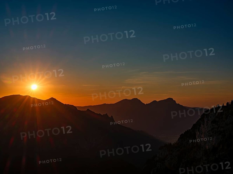 Sunset in the mountains during a partial solar eclipse, Bischofswiesen, Berchtesgadener Land, Bavaria, Germany