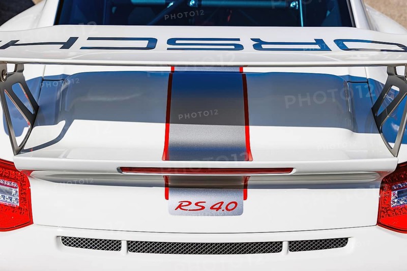 Rear wing and RS 4.0 badge of a Porsche 911 GT3 RS 4.0 at a classic car meet
