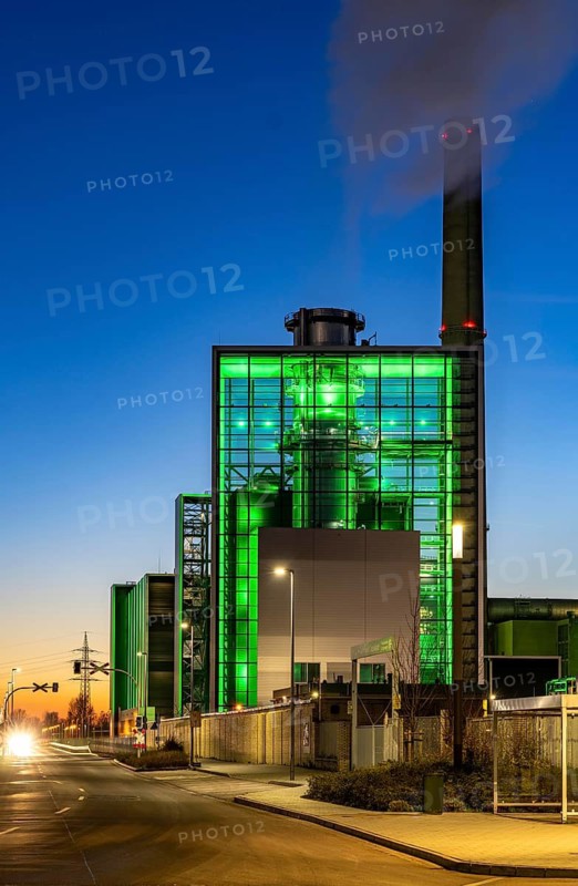 The Lausward combined heat and power plant in Düsseldorf, gas and steam turbine power plant, operated by Stadtwerke Düsseldorf and EnBW, in the harbour of Düsseldorf on the Rhine, green illuminated city window, the chimney of the Fortuna power plant unit, the power plant generates electricity, also traction current and district heating, North Rhine-Westphalia, Germany