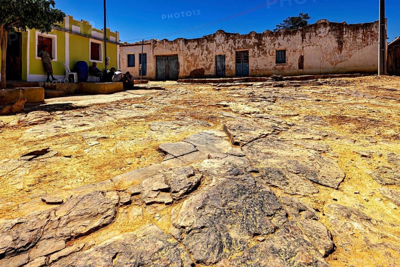 Old facades and rocky soil under blue sky, settlement and villages in the Caatinga of Pernambuco and Bahia in Brazil