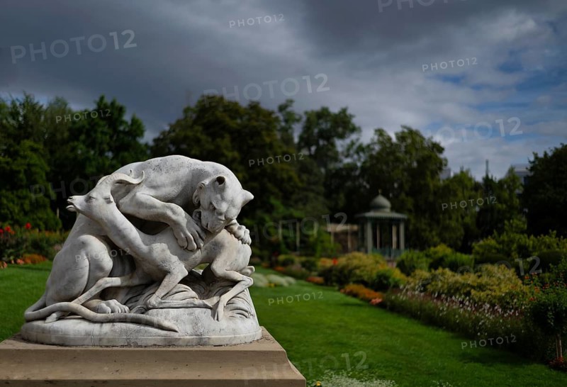 Panther jumping on the back of a gazelle, historic animal sculpture made of Carrara marble, Wilhelma, Zoologisch-Botanischer Garten, Stuttgart, Baden-Württemberg, Germany