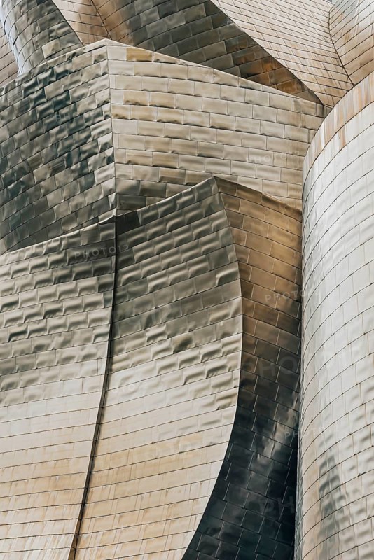 Exterior view of the Guggenheim Museum with light-reflecting titanium plates in Bilbao, Spain