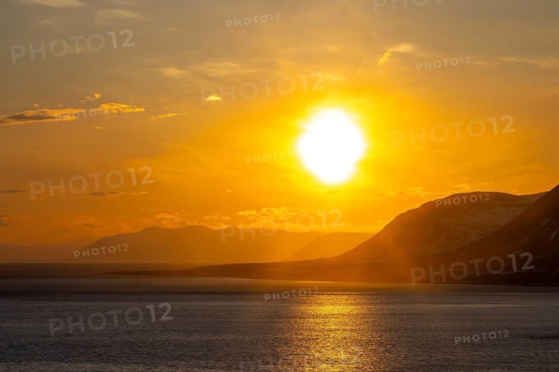 Isfjorden, Isfjord showing midnight sun at sunset in spring, Spitsbergen, Svalbard, Norway