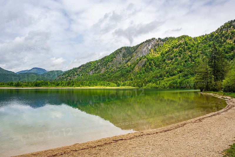 Landscape of Lake Offensee after rain when the sun comes through the clouds in spring, Salzkammergut, Austria