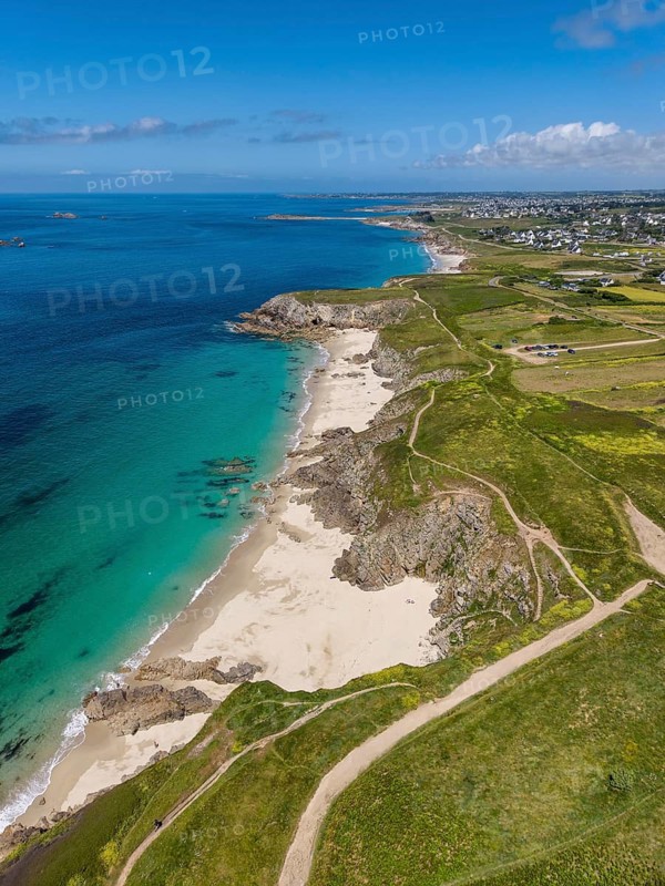 Aerial view of the sandy beach, Plage des Charettes beach north of Pointe Corsen, a cape at the westernmost point of continental France on the Breton coast, on the horizon the village of Kervilon, Commune of Plouarzel, Finistère, Brittany, France