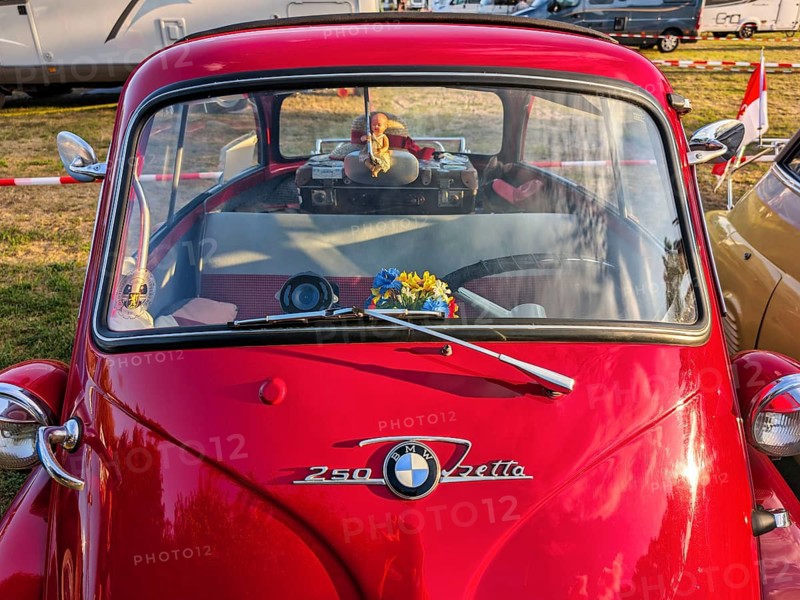BMW Isetta, annual meeting 2026, distinctive red small car with front door, decorated, cult, nostalgia, smooch ball, historical cultural property, Holzminden, Weser Hills, Germany
