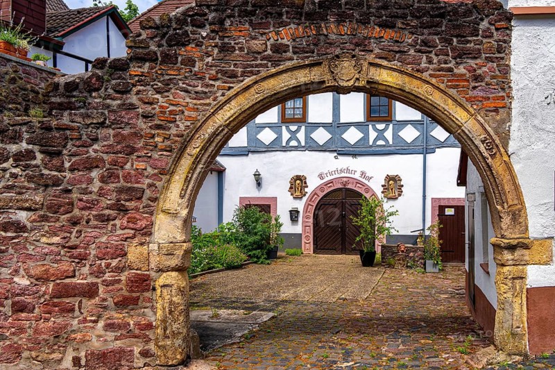The Trierische Hof in Dreieichenhain, Alter Burgmannenhof of the Lords of Heusenstamm and Solms, around 1400 owned by the Archbishop of Trier, Renaissance gate entrance from 1710, Hesse, Germany