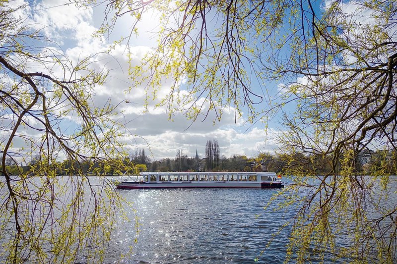 Feeling with an Alster steamer as a tourist ship on the Outer Alster in Hamburg