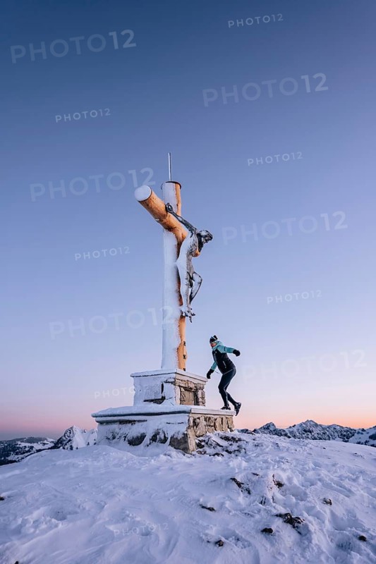 Summit bliss in the snow-covered winter landscape in the Tannheimer Tal in the Alps on the Neunerköpfle, Tyrol, Austria