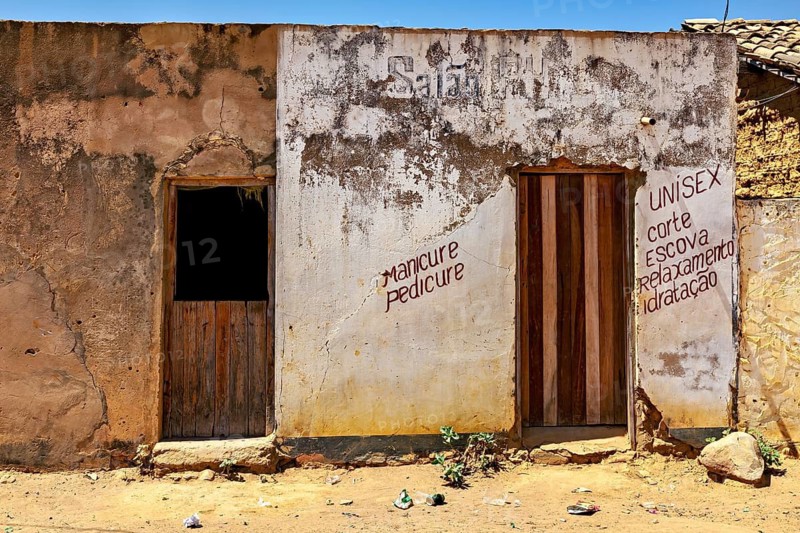 Old building with weathered walls and lettering that exudes a rural atmosphere, houses in a village in the Caatinga of Bahia in Brazil