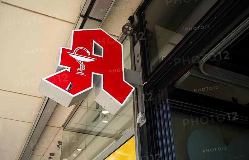 Logo, red neon sign, pharmacy sign with Aesculapian stick, Aesculapian stick, Stuttgart, Baden-Württemberg, Germany