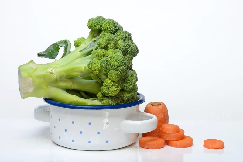 Broccoli in pots and carrot slices, Brassica oleracea var. italica