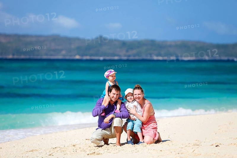 Family vacation, a young family and two children on the beach, Seychelles, La Digue, Indian Ocean, Seychelles