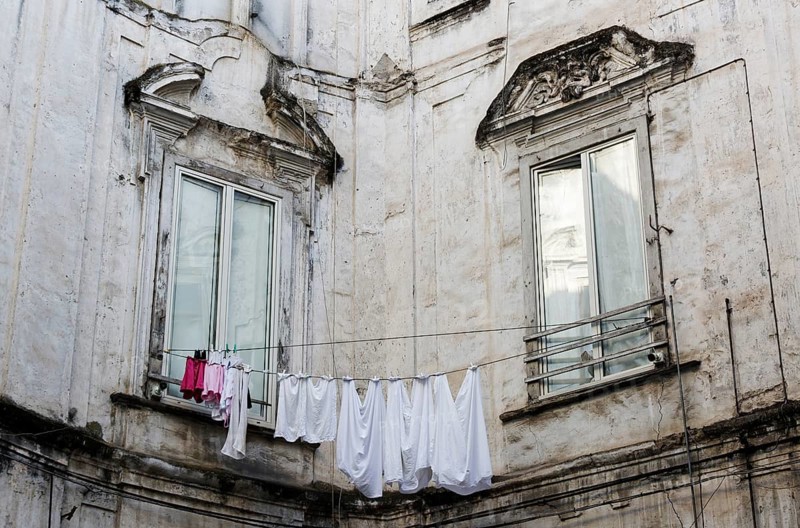 Clothesline between windows of a historic palace, Rione Sanità, Naples, Campania, Italy