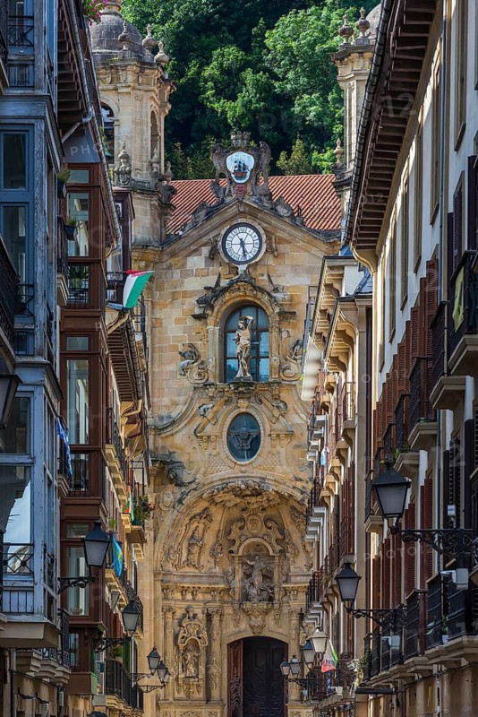 The shopping street Calle Mayor with the Basilica of Santa María del Coro in San Sebastian, Basque Country, Spain