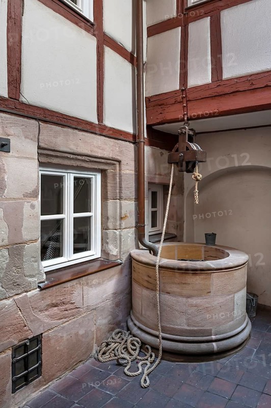 Old fountain in a historic courtyard, Obere Krämergasse 16, Nuremberg, Middle Franconia, Bavaria, Germany