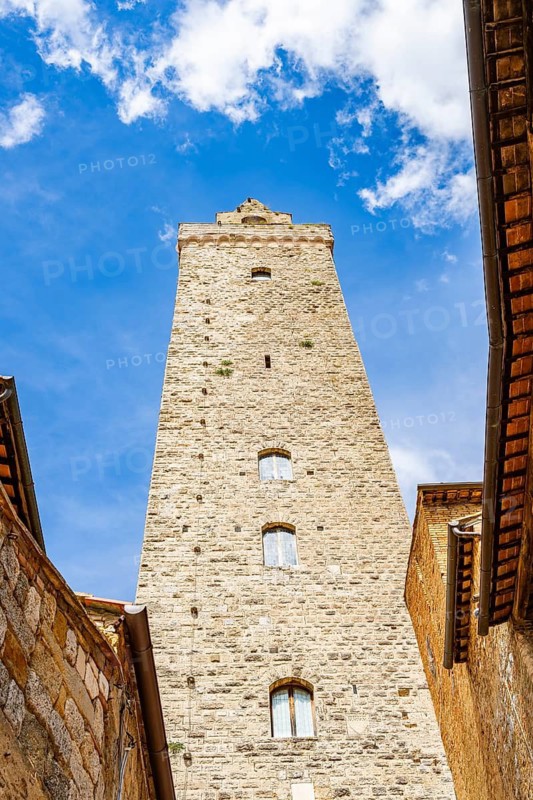 Tower of the old town with historic buildings at San Gimignano on a sunny day, Tuscany, UNESCO World Heritage, Italy, Europe, Europe