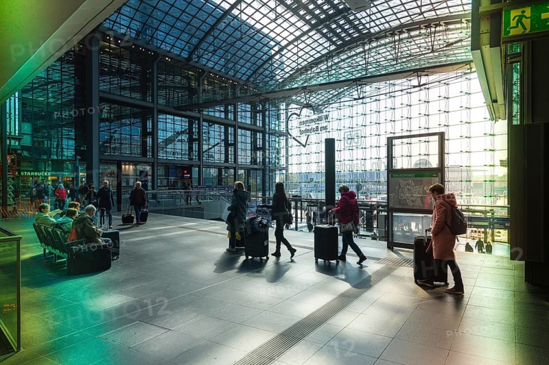Everyday scenes, travelers and railway employees as well as the interior design, signs, signposts and the DB travel center, in and at Berlin Central Station, Germany