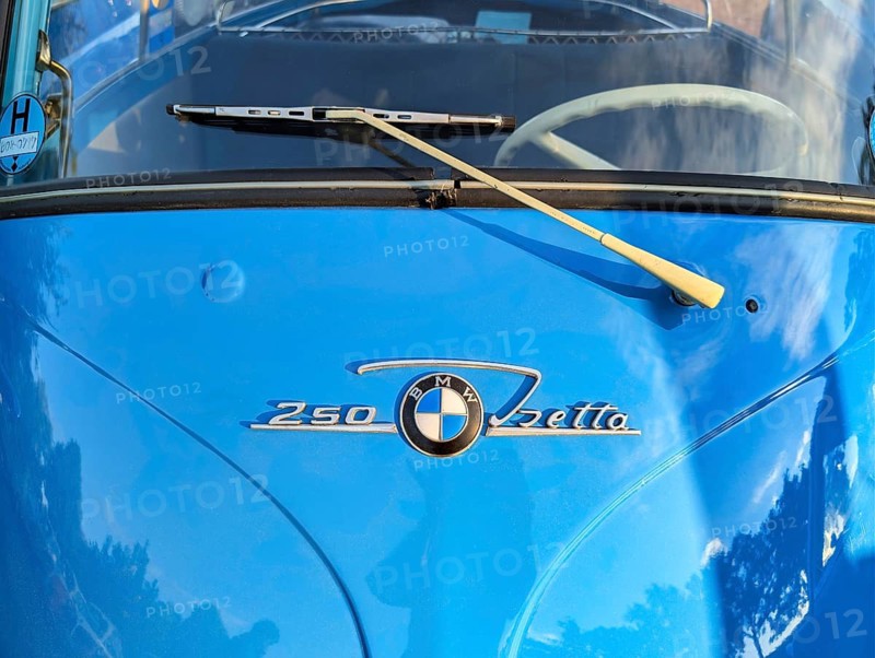 Lettering and emblem, blue BMW Isetta, distinctive small car with front door, detail of the front, symbolic photo, economic miracle, cult, nostalgia, historical cultural property, annual meeting 2026, Holzminden, Weser Hills, Germany