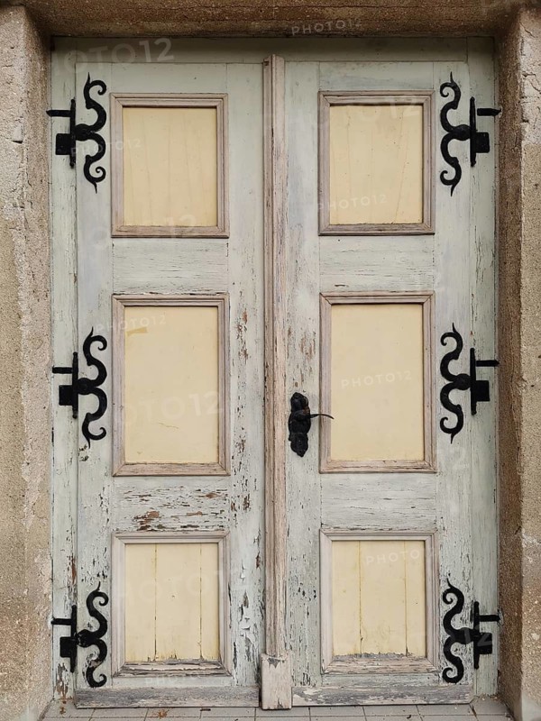 Old, weathered wooden door with metal decorations, Thuringia