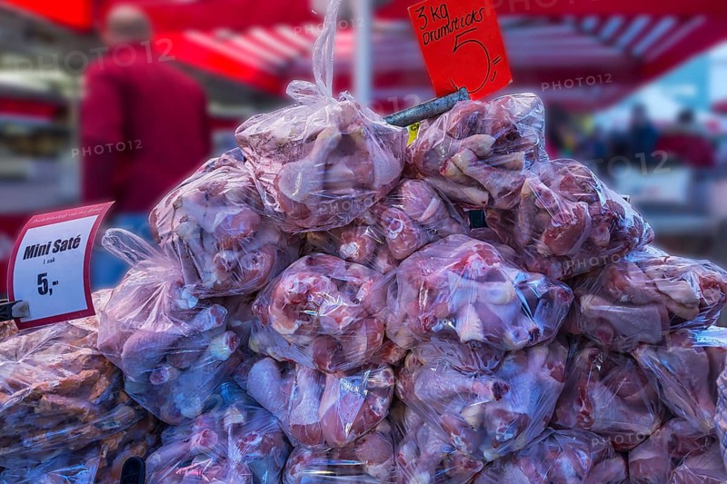 Chicken thighs packed in plastic bags, market day in Enschede, the Netherlands