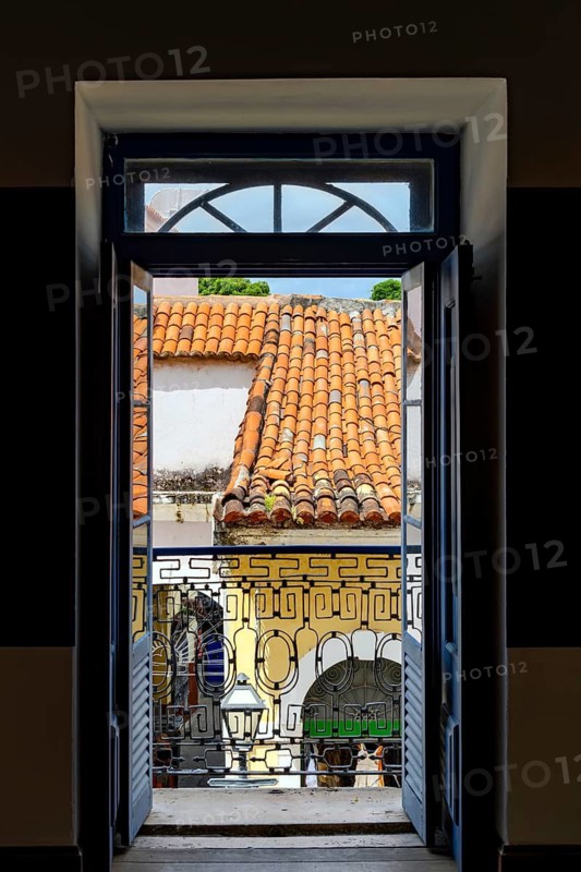 Open door in an ancient colonial house overlooking the historic center of Sao Luis, Maranhao, Sao Luis, Maranhao, Brasil