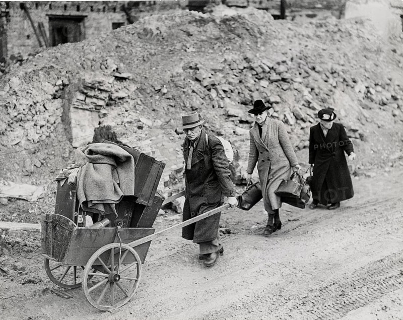 Aachen, escape from the city, ruins, last possession, fear, World War II, Three people with a cart full of belongings on a destroyed street, Ramage, 17.10.1944