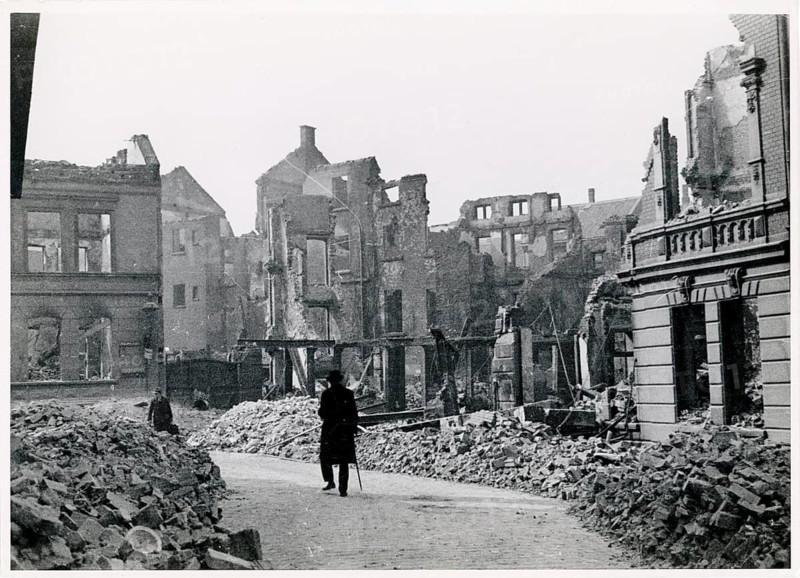 Essen, Beuststr., after bombing, ruins, cleaned up, World War II, debris, A person walks through a street full of rubble in a destroyed city, 12.12.1943
