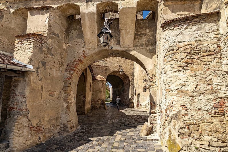 Portal to the citadel under the hour tower in Sighisoara or Sighi?oara, Transylvania, Romania