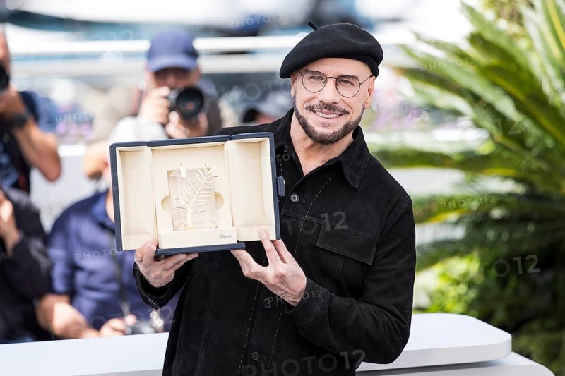 John Travolta with the Golden Palm at the Propeller One-Way Night Coach photocall at the Palais des Festivals et des Congrès during the 79th Cannes International Film Festival. The 79th Cannes International Film Festival will take place from May 12 to 23, 2026