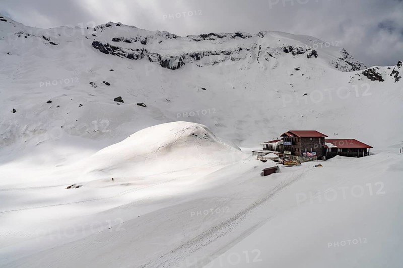 Mountain hut on snowy Balea Lake in the Fagaras Mountains, South Carpathians, Transylvania, Romania