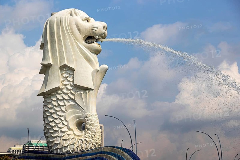 Iconic Merlion fountain spouting water designed with a lion head and fish body at Merlion Park overlooks Marina Bay, Singapore