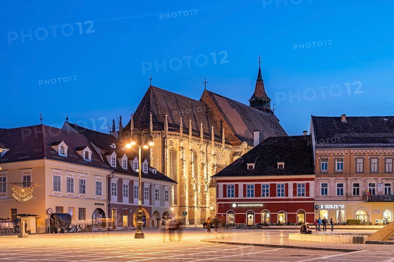 The Pia?a Sfatului, the Council Square and the Black Church in the center of Brasov or Kronstadt at dusk, Transylvania, Romania