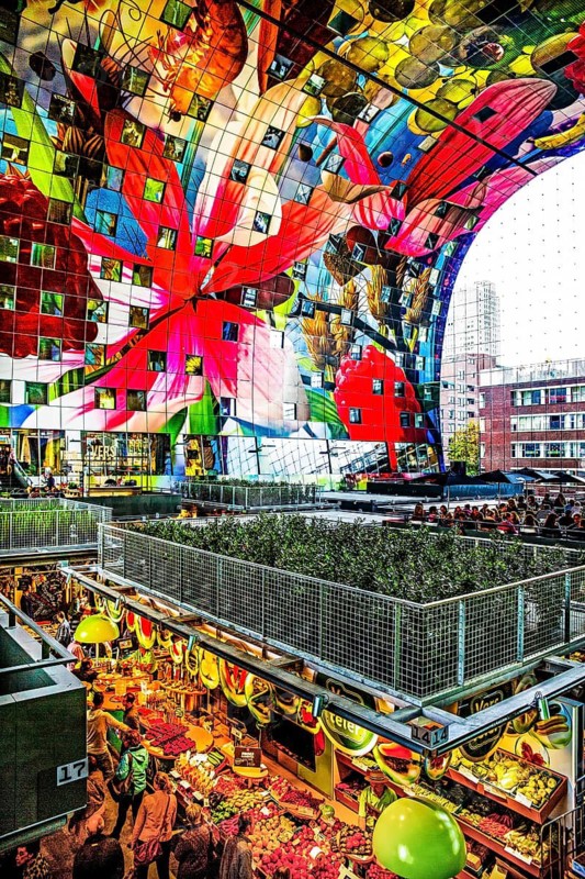Markthal from 2014, offers over 100 food stalls and delicatessens with spectacular ceiling fresco cornucopia, Horn of Plenty by Arno Coenen and Iris Roskam, Rotterdam, the Netherlands
