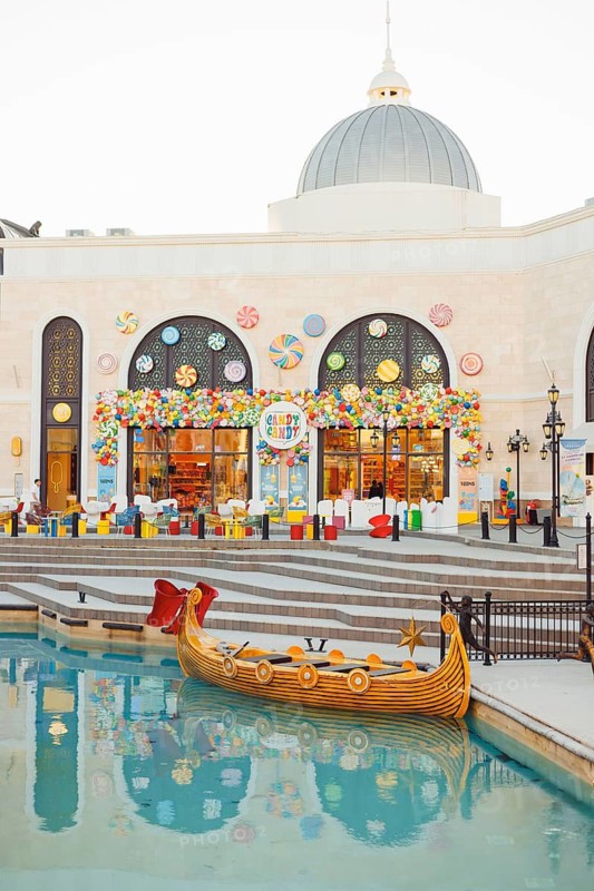 Turkiye, Antalya - 12.03.2025:The Land of Legends shopping street, aquapark and theme park is a popular tourist destination near Belek, Antalya. Fairy-tale boat gondola for tourists on water