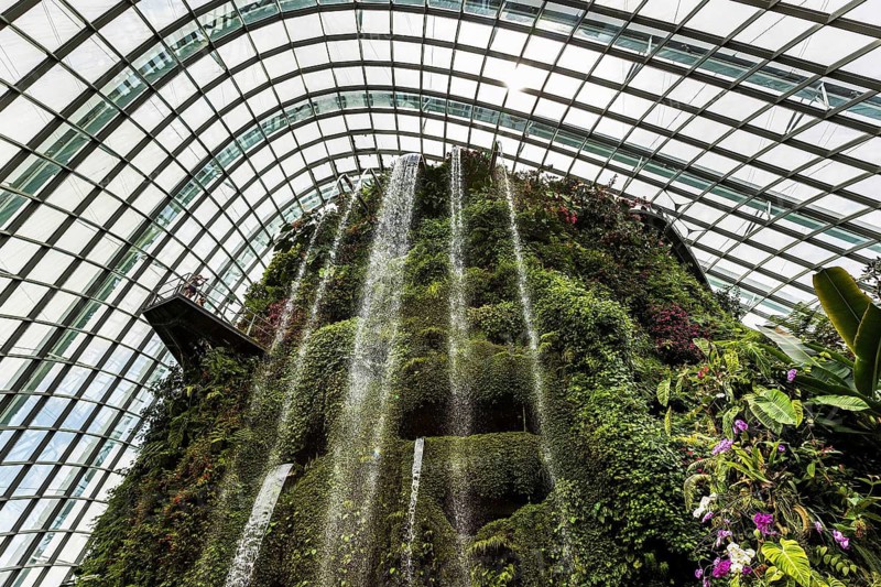 Indoor waterfall on the artificial mountain inside the Cloud Forest Botanical garden, Gardens by the Bay, Singapore
